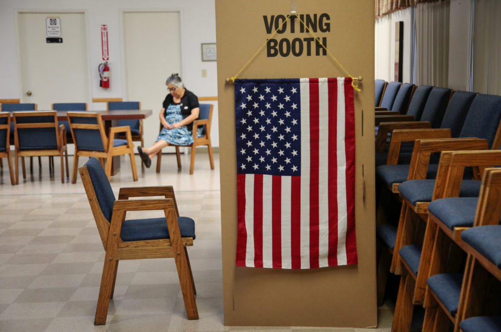 A voter waits for her party to cast their midterm election ballots at the Sisters of The Company of Mary in Tustin