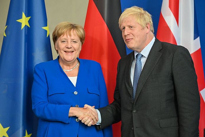 BERLIN, Aug. 21, 2019 (Xinhua) -- German Chancellor Angela Merkel (L) shakes hands with visiting British Prime Minister Boris Johnson in Berlin, Germany, on Aug. 21, 2019. Angela Merkel and Boris Johnson on Wednesday reiterated the Brexit with a deal, but were different in approaches. (Xinhua/Lian Zhen/IANS)