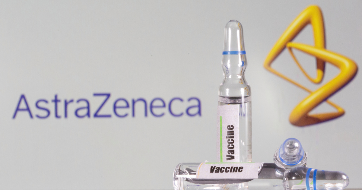 FILE PHOTO: A test tube labelled with the vaccine is seen in front of AstraZeneca logo in this illustration taken