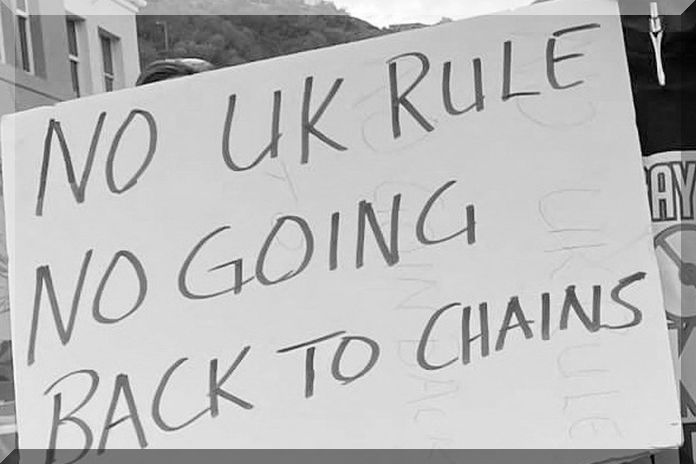Activists at a rally call for the British Virgin Islands to retain its autonomy