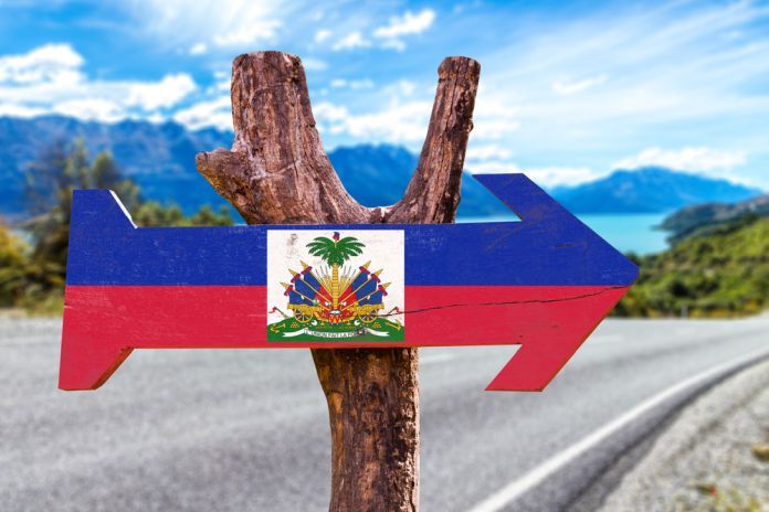 Haiti,Flag,Wooden,Sign,With,Road,Background